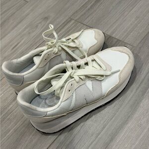 New Balance shoes Size 8. It is white/grey. In great condition, worn two times!